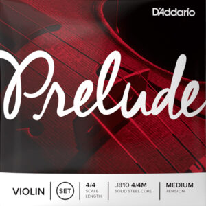 Close-up of D'Addario's Prelude violin string packaging. The design features the word "Prelude" in large cursive and details like "4/4 Scale Length" and "Medium Tension." The background shows a part of a violin.