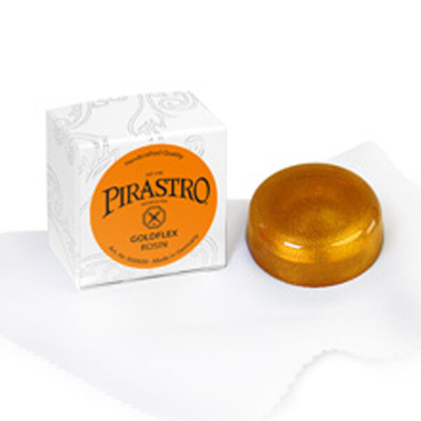 A container of Goldflex Rosin rests on a white cloth beside its packaging box. The rosin has an amber-colored, glossy appearance, while the white box features decorative patterns and prominently displays the product's branding.